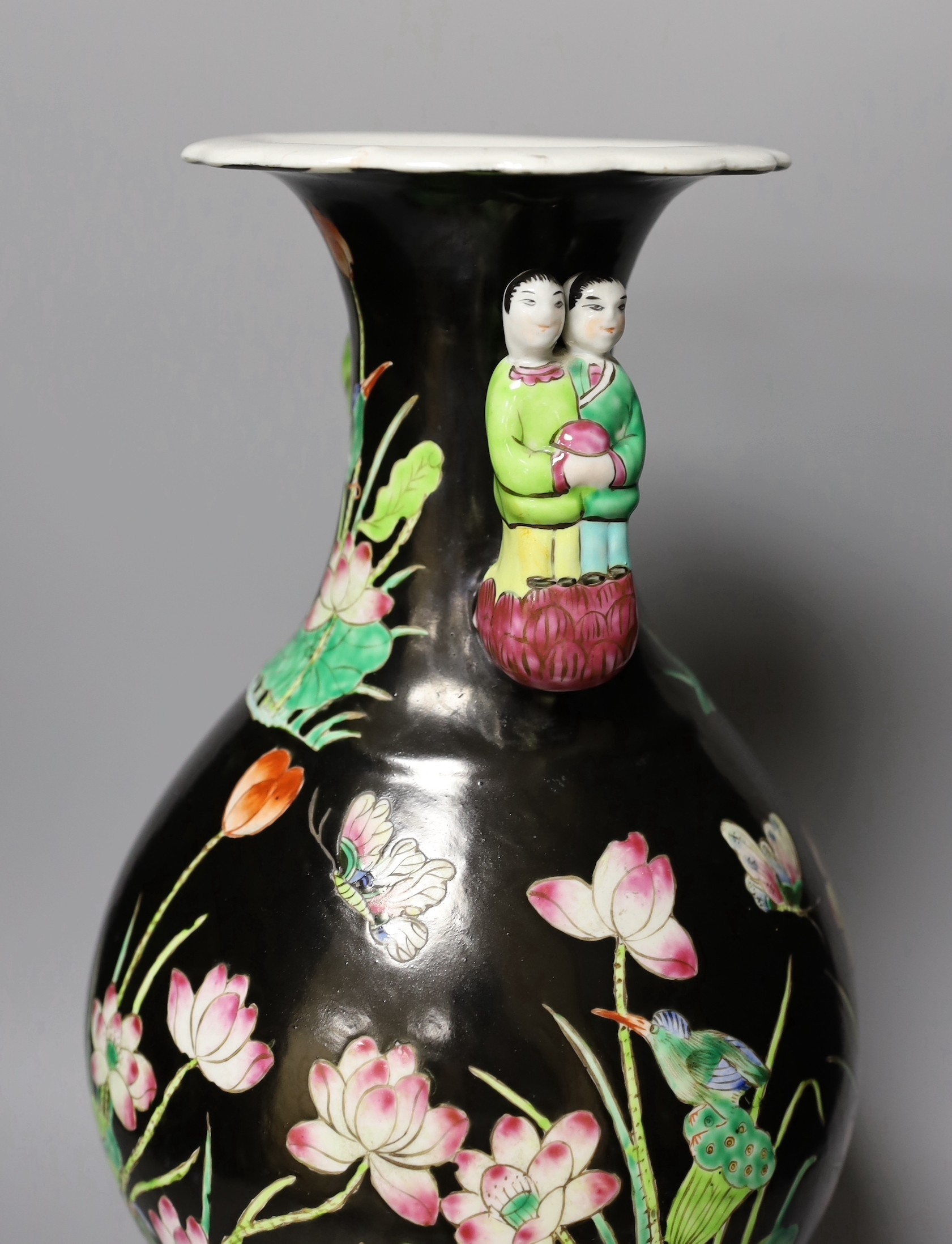 A Chinese famille noire vase, on plinth, 46 cms high